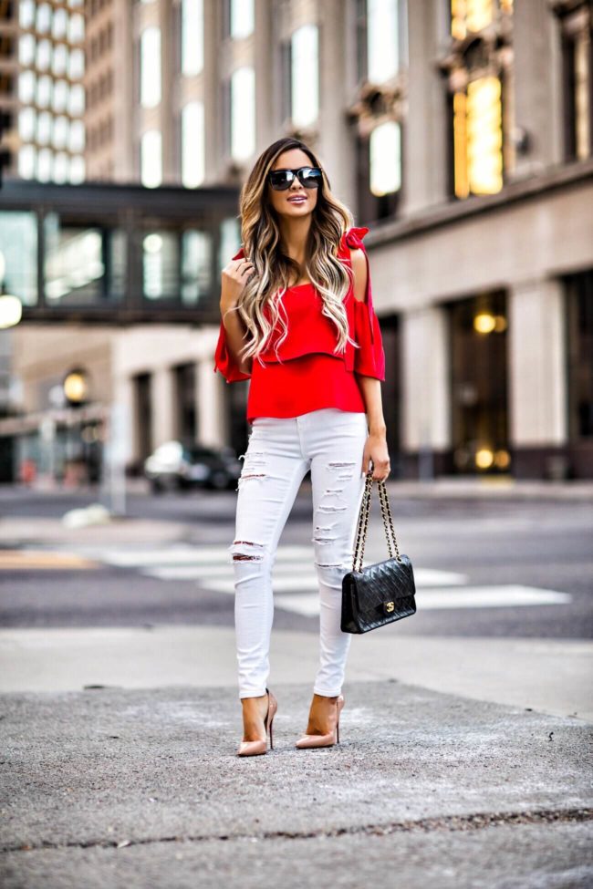 white jeans red top