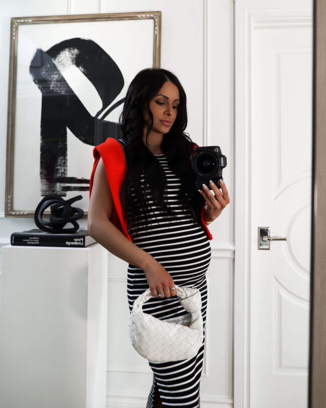 fashion blogger mia mia mine wearing a black and white stripe dress from walmart