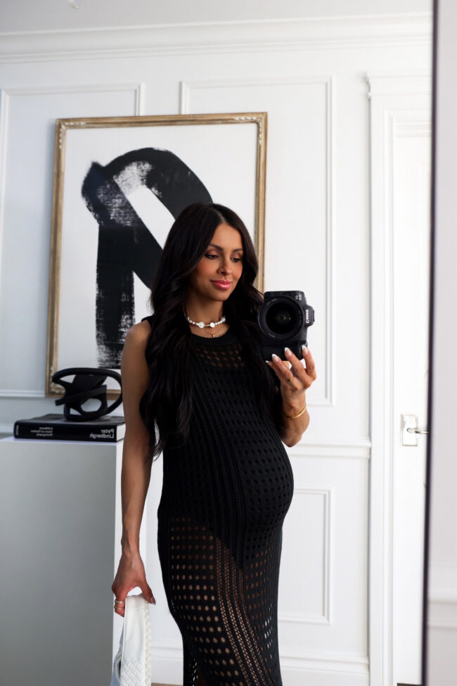 fashion blogger mia mia mine wearing a black crochet coverup dress
