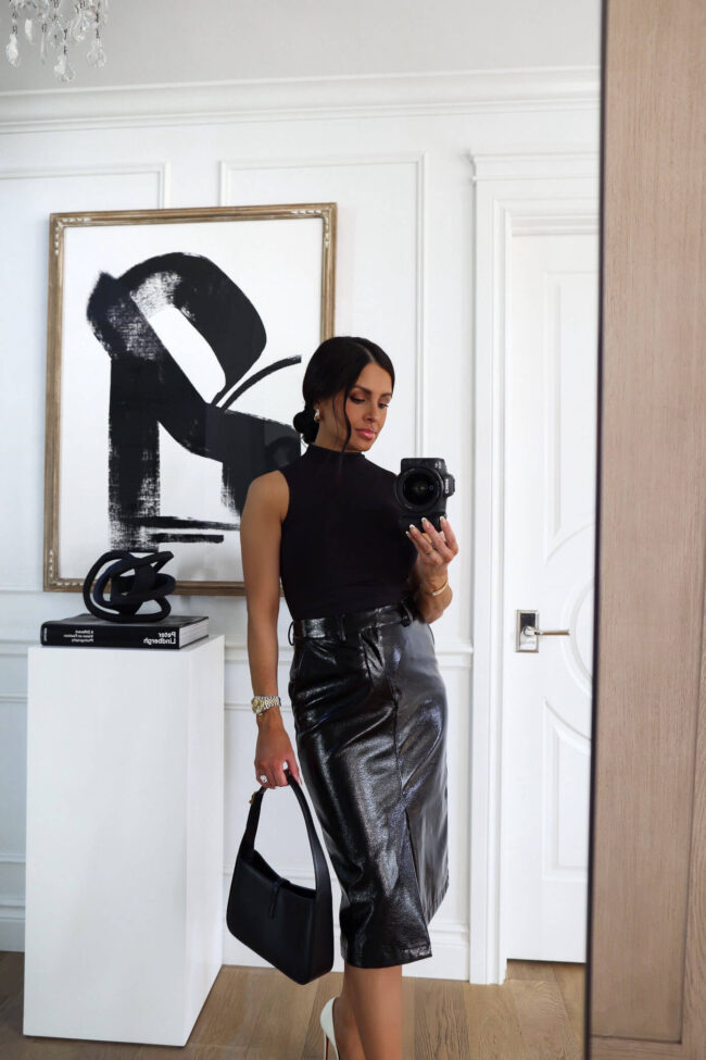 fashion blogger mia mia mine wearing a black patent skirt and bodysuit from walmart