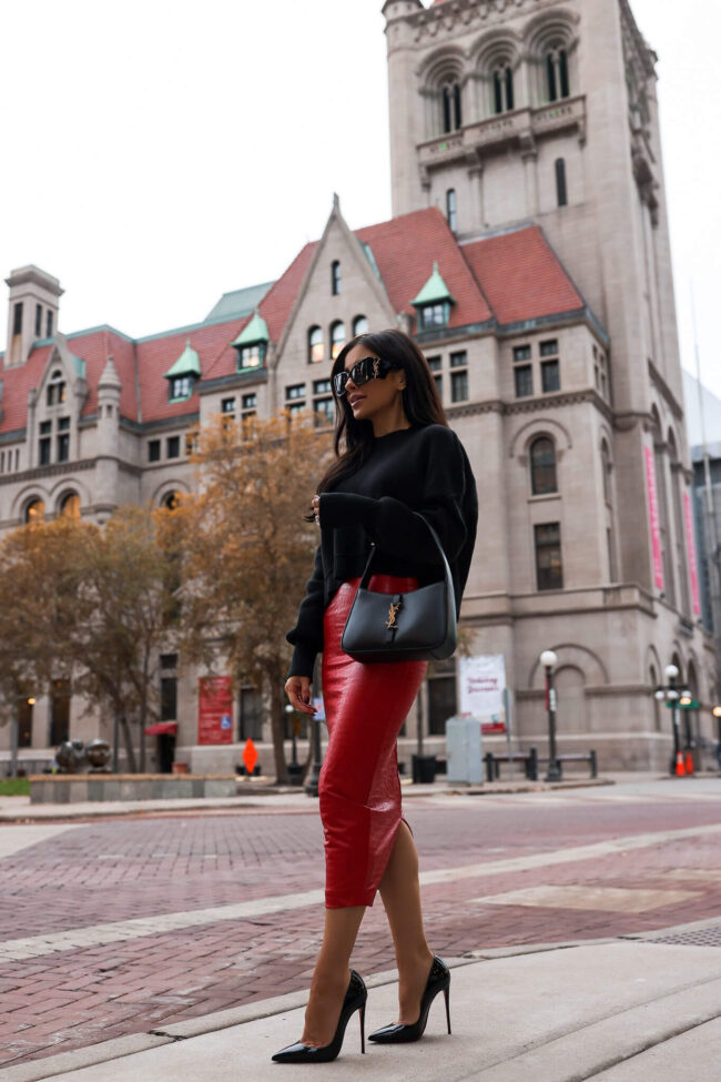 fashion blogger mia mia mine wearing a red faux leather skirt from nordstrom for fall 2023