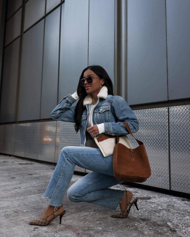 fashion blogger mia mia mine wearing mother denim and a mother denim shearling jacket from saks