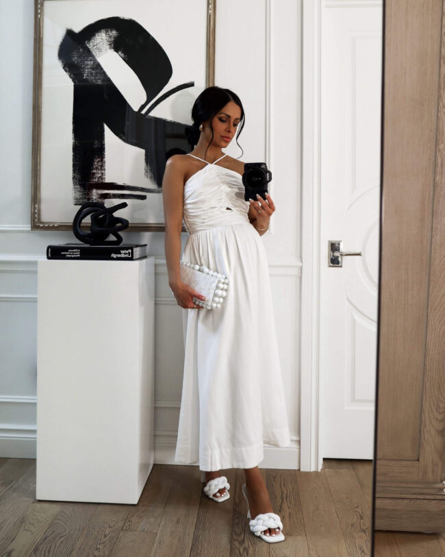 fashion blogger mia mia mine wearing a white linen halter dress from walmart