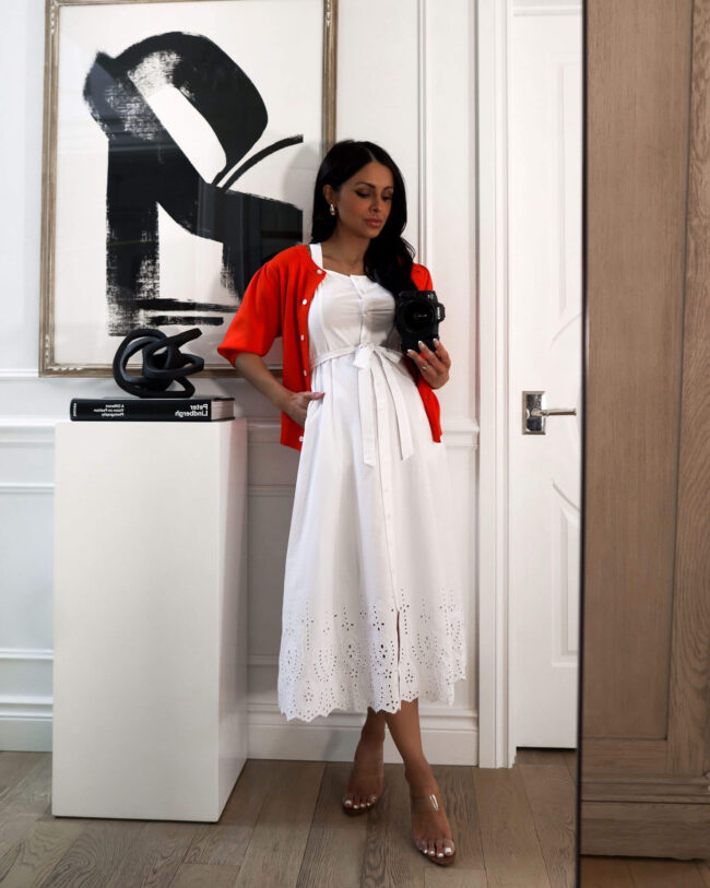 fashion blogger mia mia mine wearing a white eyelet dress from walmart and a red short sleeve cardigan