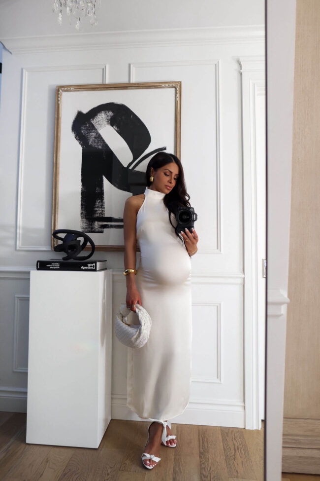 pregnant fashion blogger wearing a white dress for summer