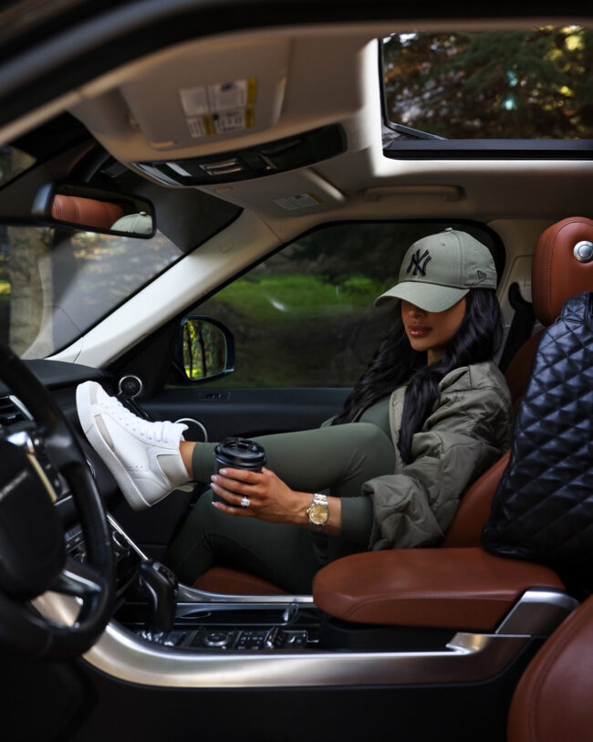 brunette fashion blogger wearing white high top sneakers