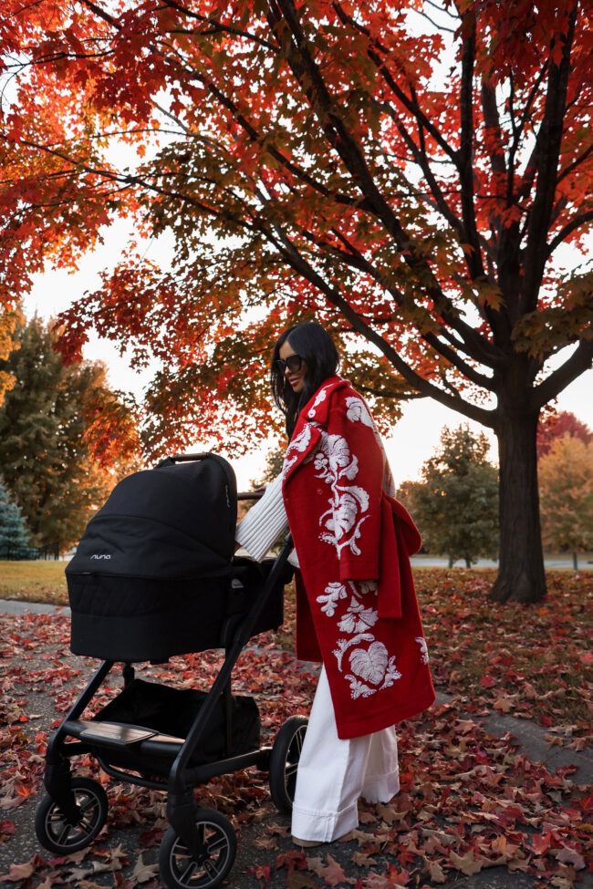 brunette fashion blogger wearing a red coat by farm rio