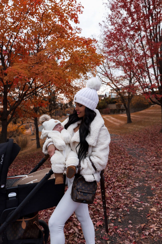 fashion blogger wearing a faux shearling moto jacket from revolve